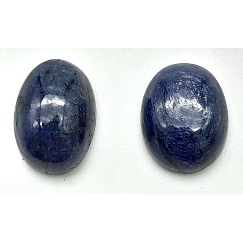 622 - A Pair of 21.30ct Blue Sapphire Gemstone Cabochon. Oval Shapes.