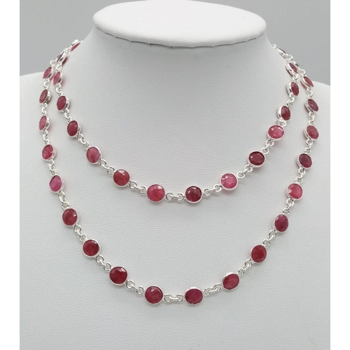 1104 - A Ruby Gemstone Matinee Length Necklace. Circle cut gemstones set in 925 Silver. 21.21g total weight... 