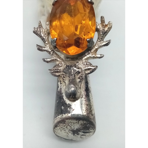 1111 - A 1959 Grouse Claw, Edinburgh hallmarked Silver Brooch.
Lovely stag head, amber colour stone feature... 