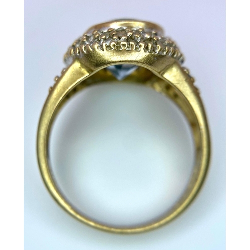 118 - A vintage 9K yellow gold stone set and Aquamarine solitaire ring. Total weight 4.35G. Size M.