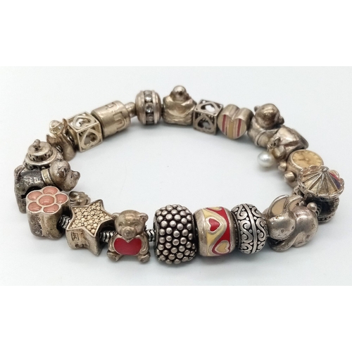 119 - A vintage 925 silver multiple charms bracelet such as teddy bear, animals, etc. Total weight 64.25G.... 