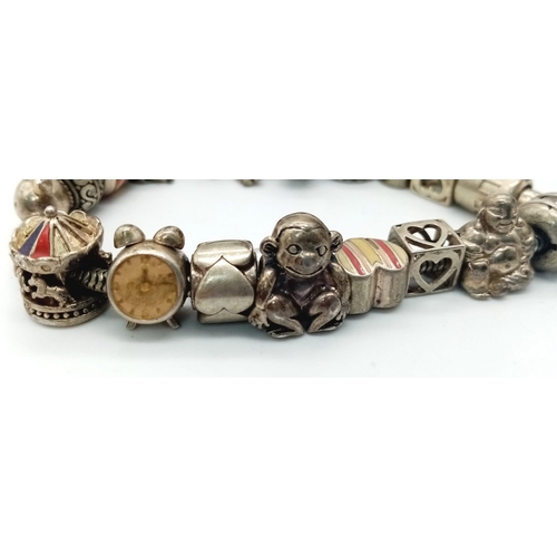 119 - A vintage 925 silver multiple charms bracelet such as teddy bear, animals, etc. Total weight 64.25G.... 