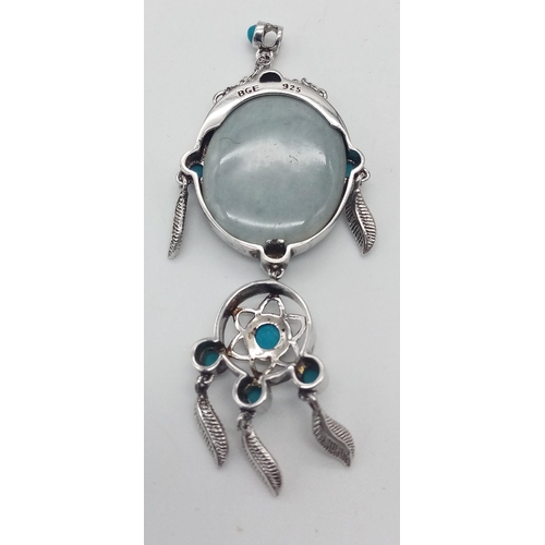 125 - A fancy 925 silver Turquoise Wolf Dreamcatcher pendant. Total weight 9G. Please see photos for detai... 