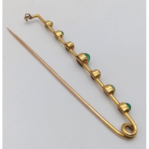 177 - An Antique High-Karat Gold, Diamond and Emerald Bar Brooch. Classic safety pin design with central e... 