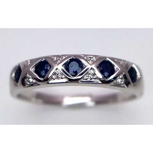 193 - A 9K WHITE GOLD DIAMOND & SAPPHIRE RING. TOTAL WEIGHT 2.1G. SIZE M