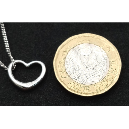 32 - A 9K WHITE GOLD HEART PENDANT ON CHAIN. TOTAL WEIGHT 3.5G. TOTAL LENGTH 50CM.