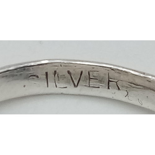 379 - STERLING SILVER ST CHRISTOPHER RING.
SIZE: I
WEIGHT: 2.2G

SC 8060