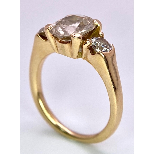 415 - An 18K Yellow Gold and Diamond Ring. 1.5ct oval cut central diamond with 0.15ct diamonds either side... 