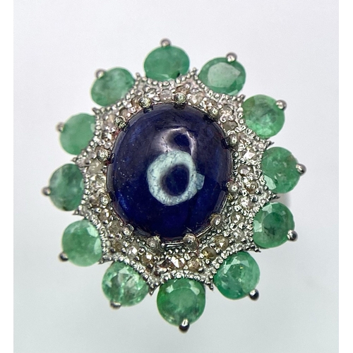 481 - A 7.60Ct Oval Tanzanite Gemstone Ring - with 3ctw Emerald and 0.40ctw Diamond Surrounds. Set in 925 ... 