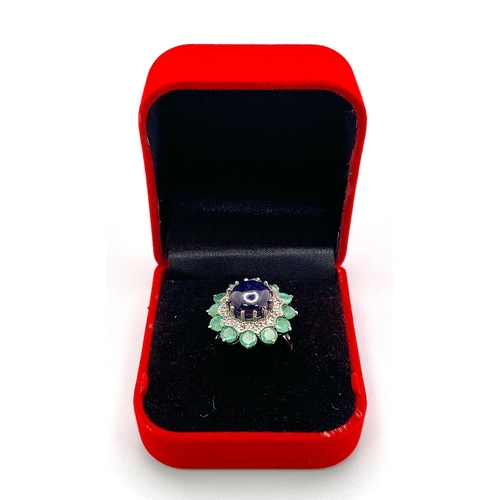 481 - A 7.60Ct Oval Tanzanite Gemstone Ring - with 3ctw Emerald and 0.40ctw Diamond Surrounds. Set in 925 ... 