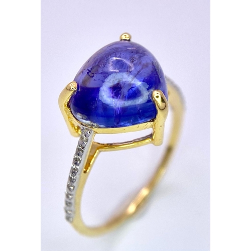 508 - A 14K Yellow Gold Tanzanite Ring. 5ct central tanzanite with 0.10ctw of diamond accents. Size M. 2.6... 