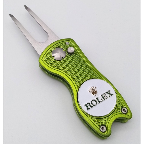 A Rolex Branded Golf Putting Green Divot Repair Tool with