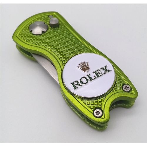 570 - A Rolex Branded Golf Putting Green Divot Repair Tool with Removable Ball Marker. Flick blade design!... 