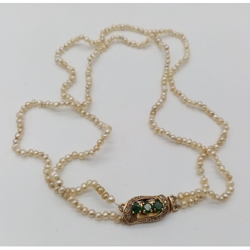 661 - An Antique Seed Pearl Necklace with a Mid-Karat Gold, Emerald and Diamond Clasp. 40cm. 10.41g total ... 