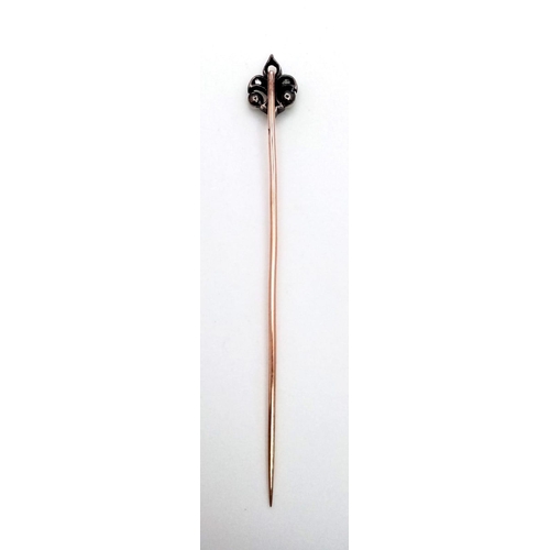 703 - An Antique Mid-Karat Gold Fleur-de-lis, Diamond and Pearl Stick Pin. Note - one old cut diamond is m... 