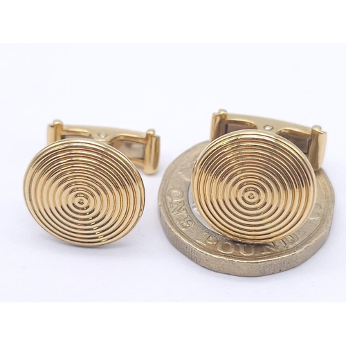 738 - A Pair of Designer Theo Fennell 18K Yellow Gold Spiral Cufflinks. 12.2g total weight. Ref: 15258