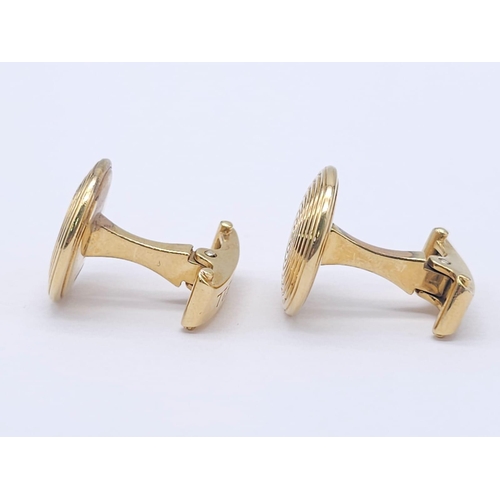 738 - A Pair of Designer Theo Fennell 18K Yellow Gold Spiral Cufflinks. 12.2g total weight. Ref: 15258