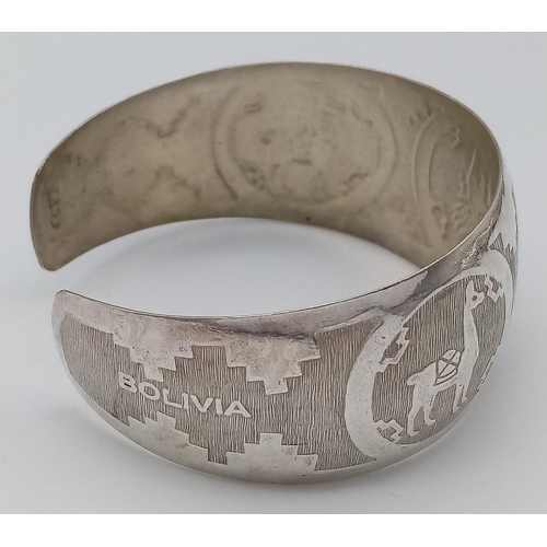 126 - A Bolivian silver cuff bangle with nicely engraved. Total weight 14.2G. Please see photos for detail... 