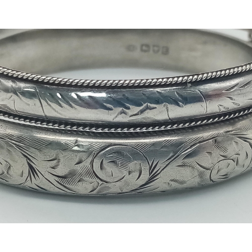 237 - 2X vintage sterling silver click-on bangles with flower motif. One of them come with full Chester ha... 