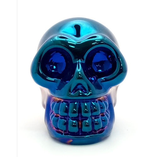 330 - A Quartz Skull Figure with a Metallic Blue Coating. The perfect cabinet of curiosity ornament or pap... 