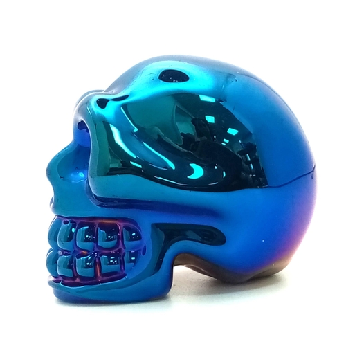 330 - A Quartz Skull Figure with a Metallic Blue Coating. The perfect cabinet of curiosity ornament or pap... 