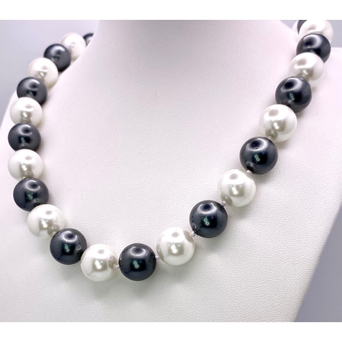 155 - An Attractive Silver and White South Sea Pearl Shell Bead Necklace - 14mm large beads. Necklace leng... 