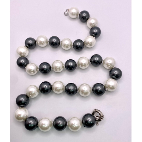 155 - An Attractive Silver and White South Sea Pearl Shell Bead Necklace - 14mm large beads. Necklace leng... 