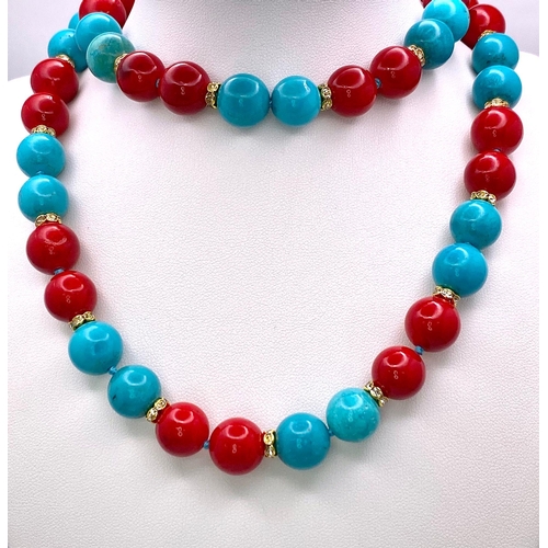 313 - An Eclectic Blue Turquoise and Red Coral Necklace. Gilded and white stone spacers. 12mm beads. 64cm ... 