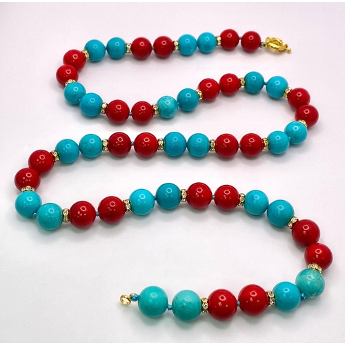 313 - An Eclectic Blue Turquoise and Red Coral Necklace. Gilded and white stone spacers. 12mm beads. 64cm ... 