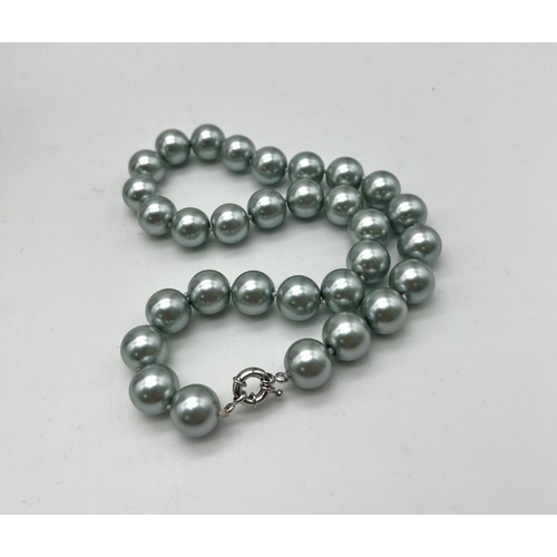 642 - An Attractive Silver South Sea Pearl Shell Bead Necklace. 14mm beads. 42cm necklace length.