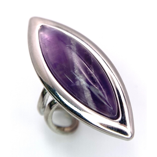 950 - A Vintage Sterling Silver Modernist Design Amethyst Set Ring Size P
(Adjustable). Set with a 3cm Lon... 