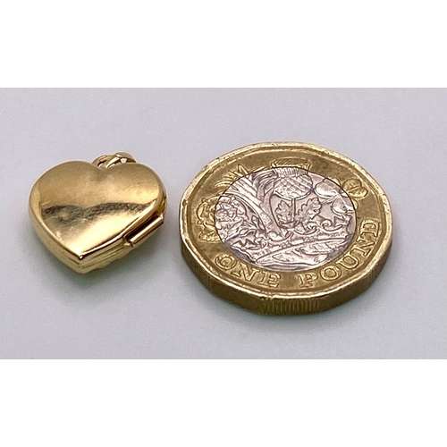 796 - A 9K YELLOW GOLD ENGRAVED HEART LOCKET, AS NEW.  2cm length, 1g total weight.