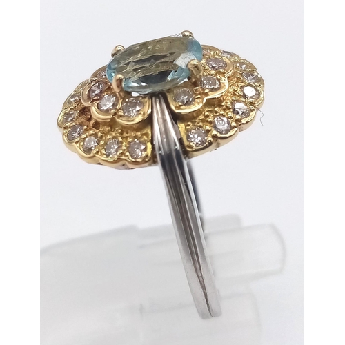 704 - 18k 2 colour diamond and aquamarine dress ring.
Weight: 7.4g 
Size Q
(dia:0.84ct/aqua:1.10ct)