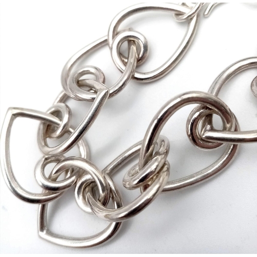 801 - A Sterling silver heart link bracelet 20cm length, 34.5g