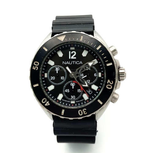 822 - A Nautica Chronograph Quartz Gents Watch. Black rubber strap . Stainless steel case - 46mm. Black di... 