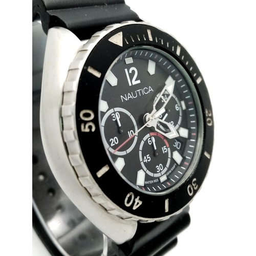 822 - A Nautica Chronograph Quartz Gents Watch. Black rubber strap . Stainless steel case - 46mm. Black di... 