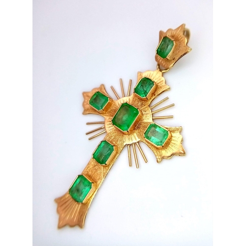 1138 - A Vintage 18K Yellow Gold and Emerald Cross. 1.2ctw of rich green emeralds decorate this holy symbol... 