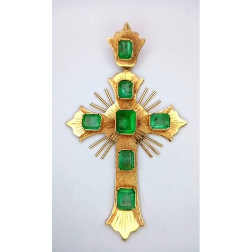 1138 - A Vintage 18K Yellow Gold and Emerald Cross. 1.2ctw of rich green emeralds decorate this holy symbol... 