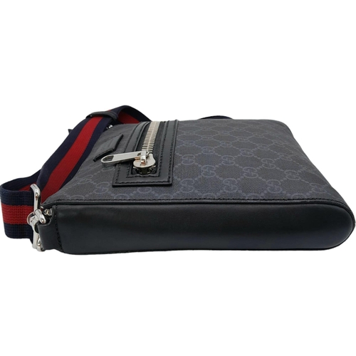 480 - A Black Gucci Cross-Over Satchel.
With a quality red & navy adjustable strap, this satchel can be wo... 