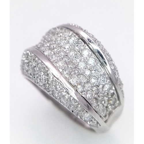 626 - A Glorious 18K White Gold and Pave Diamond Swirl Dress Ring. 14mm width. 1.2ctw diamonds. Two small ... 