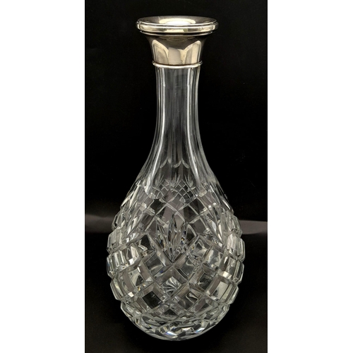 141 - A BEAUTIFUL HEAVY CUT GLASS DECANTER WITH A SOLID SILVER COLLAR AND HALLMARKED BIRMINGHAM 1992 , STA... 