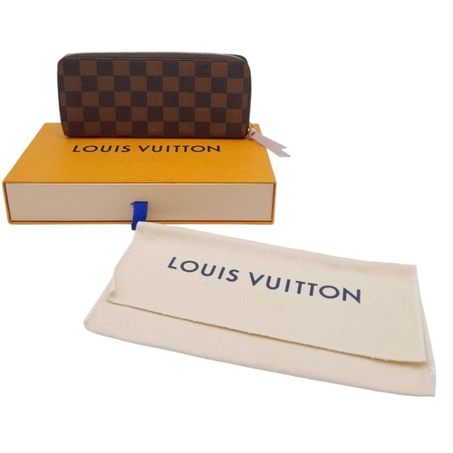 142 - A Louis Vuitton Clemence Wallet. Checked canvas exterior. Zipped and open compartment interior. Come... 