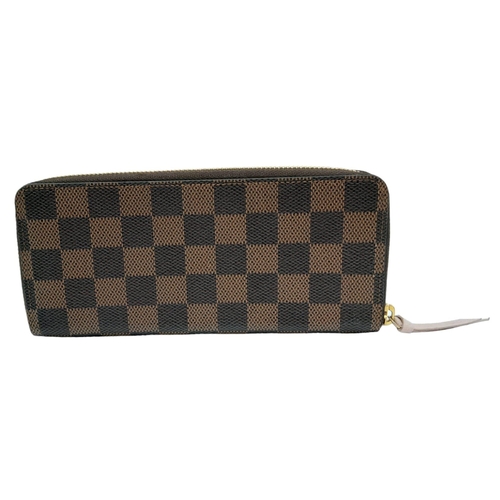 142 - A Louis Vuitton Clemence Wallet. Checked canvas exterior. Zipped and open compartment interior. Come... 