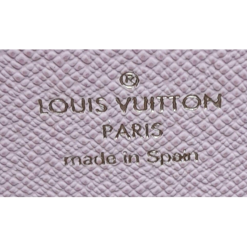 142 - A Louis Vuitton Clemence Wallet. Checked canvas exterior. Zipped and open compartment interior. Come... 