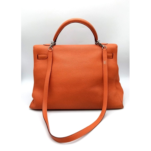 176 - A Hermes Kelly Orange Leather Bag. Textured burnt orange leather exterior. Open and zipped interior ... 