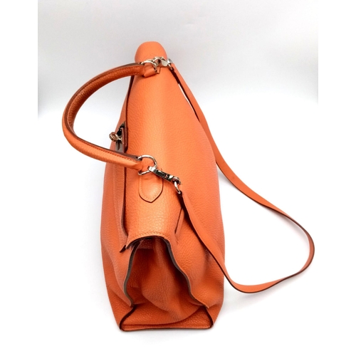 176 - A Hermes Kelly Orange Leather Bag. Textured burnt orange leather exterior. Open and zipped interior ... 