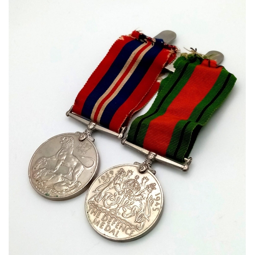 183 - THE GEORGE VI DEFENCE MEDAL PLUS THE 1939-1945 MADAL WITH RIBBONS AND ON A 2 MEDAL BAR.