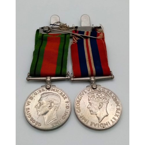 183 - THE GEORGE VI DEFENCE MEDAL PLUS THE 1939-1945 MADAL WITH RIBBONS AND ON A 2 MEDAL BAR.