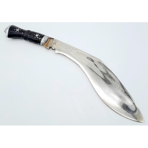 190 - A CEREMONIAL GHURKA'S KHUKRI IN BLACK LEATHER SCABBARD WITH SILVER TIP.   TOTAL LENGTH 34cms