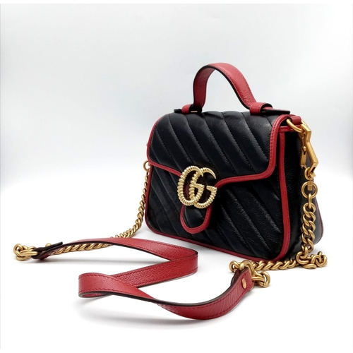 249 - A Gucci Marmont Torchon Mini Handbag. Two-tone padded leather exterior with a large GG gilded clasp.... 